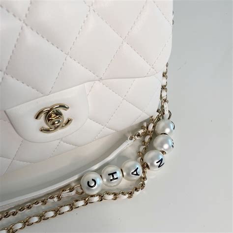 chanel pearl logo strap flap bag|Chanel flap bag price euro.